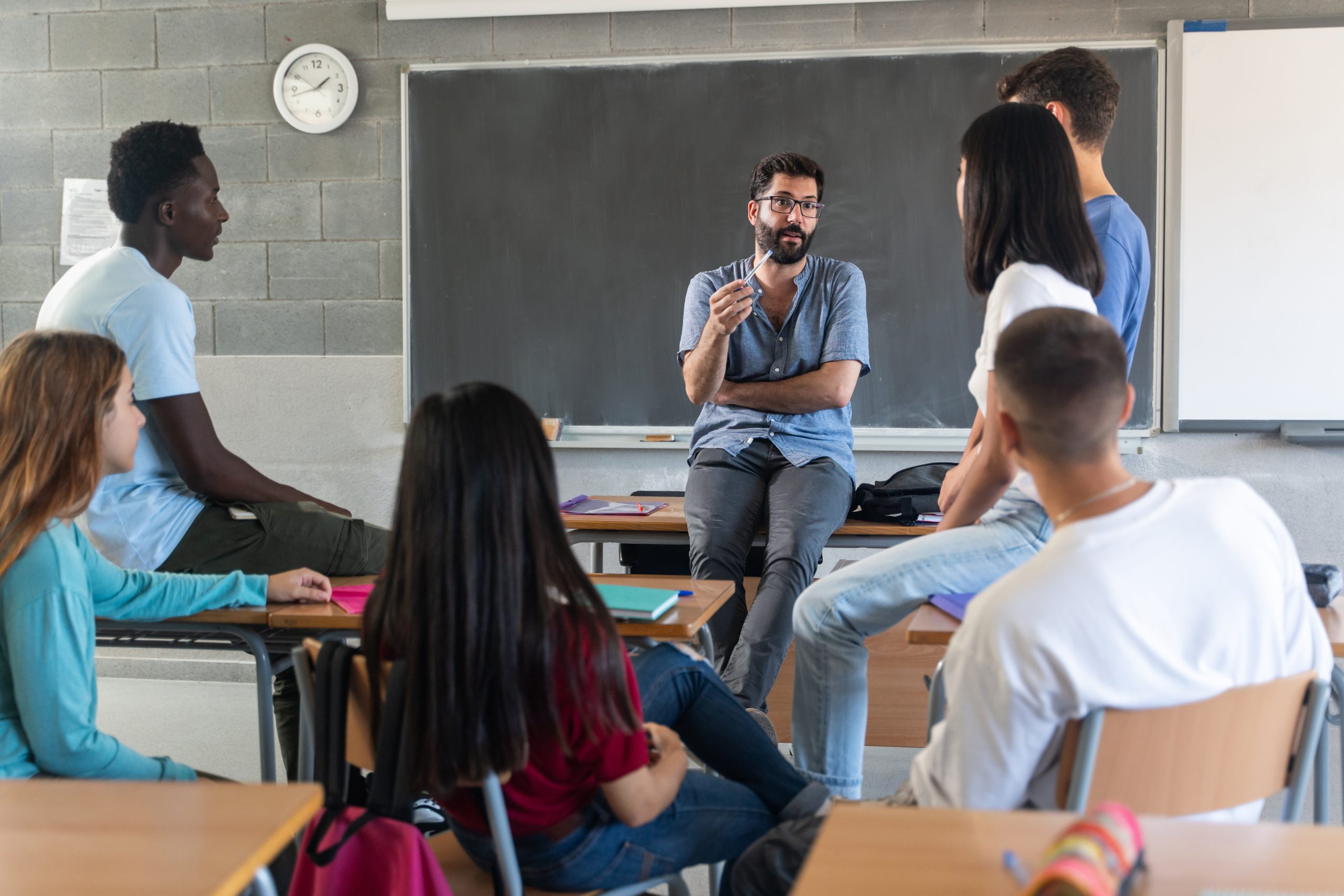Student sitting alone in a classroom